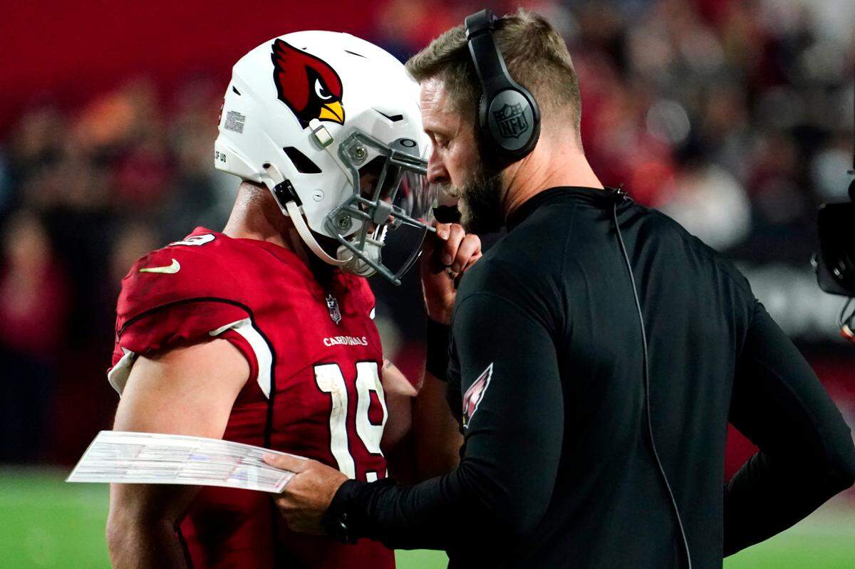 Arizona Cardinals quarterback Trace McSorley talks with head coach Kliff Kingsbury during Sunday’s game against the Tampa Bay Buccaneers. The Buccaneers defeated the Cardinals 19-16 in overtime.