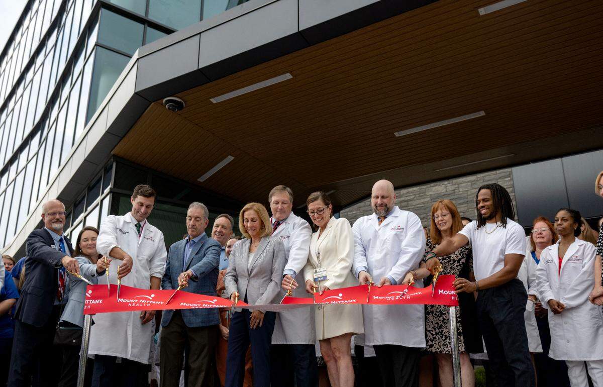 Health care providers and local leaders gather for the ribbon cutting at the Mount Nittany Health Toftrees on Tuesday, Aug. 27, 2024.