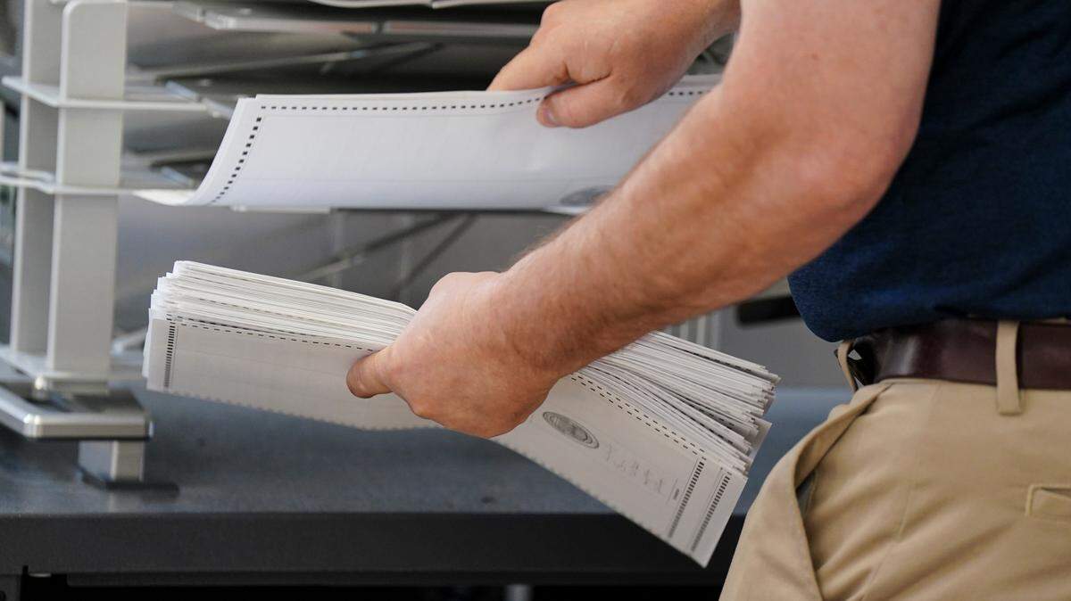 Workers sort mail ballots on primary Election Day 2024 at Northampton County Courthouse in Easton, Pennsylvania.