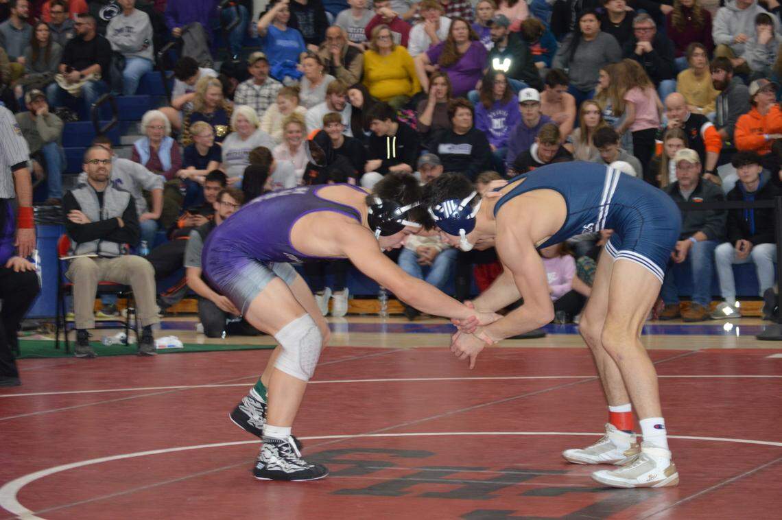 Philipsburg-Osceola’s Austin Foster (right) looks for an opening on Mifflin County’s Parker Kearns in their 152-pound third-place match of the Ultimate Warrior Tournament on Saturday at West Branch High School in Allport. Kearns defeated Foster, 3-1.
