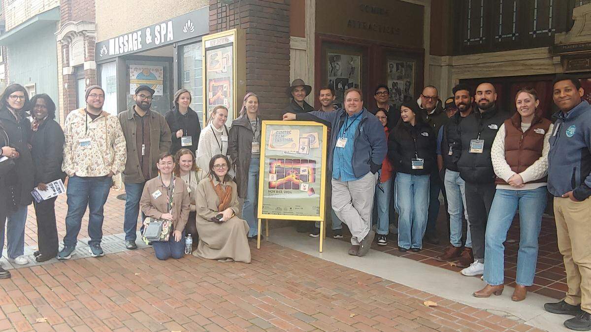 A tour of visiting filmmakers hosted by the Happy Valley Adventure Bureau and the Happy Valley Sports & Entertainment Alliance is pictured at the Rowland Theatre in Philipsburg during the Centre Film Festival.
