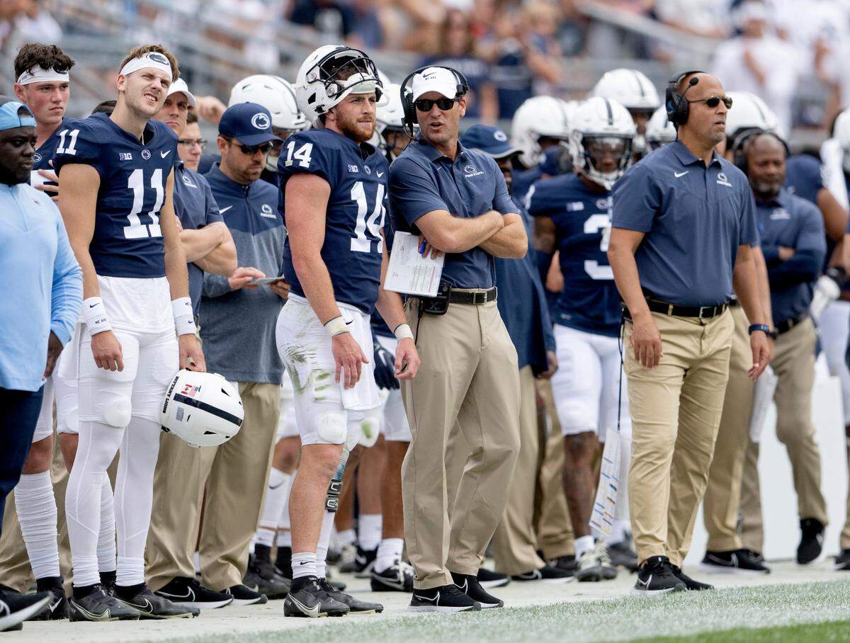 Penn State offensive coordinator Mike Yurcich talks to quarterback Sean Clifford during the game against Ohio on Saturday, Sept. 10, 2022.