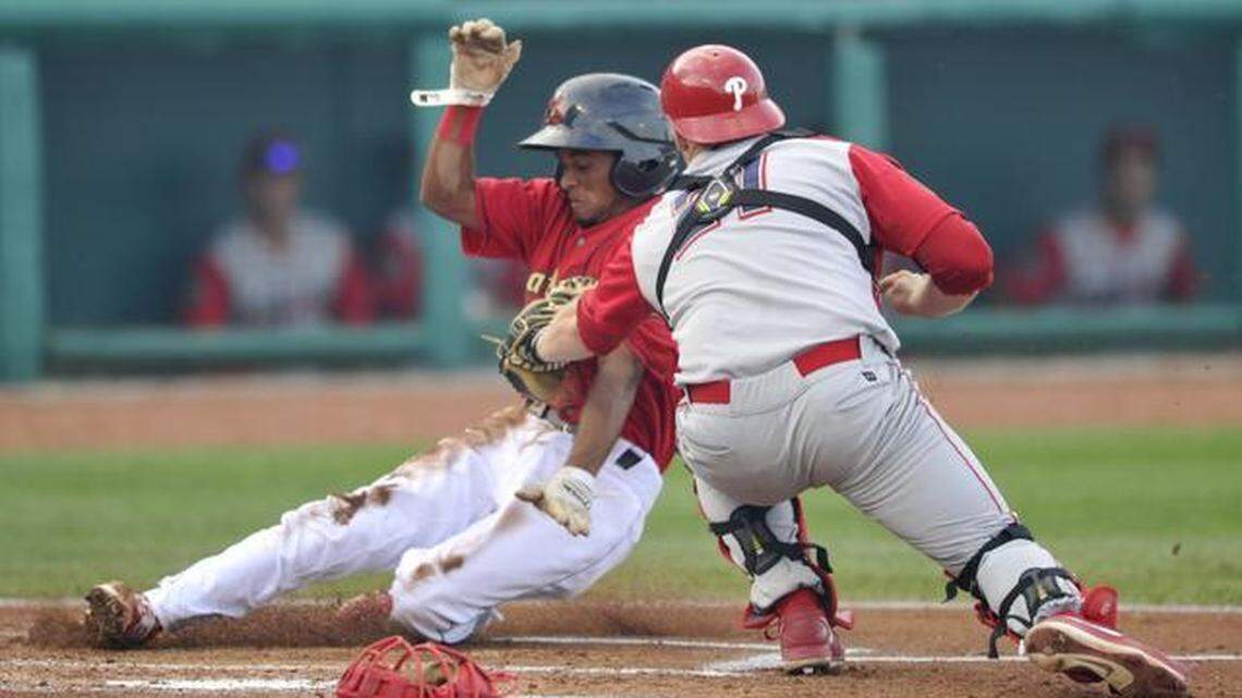 State College's Robelys Reyes is tagged out by Williamsport catcher Sean McHugh on Friday at Medlar Field at Lubrano Park. Reyes went 3-for-5, however, and scored a pair of runs in the Spikes’ 5-2 win over the Crosscutters.
