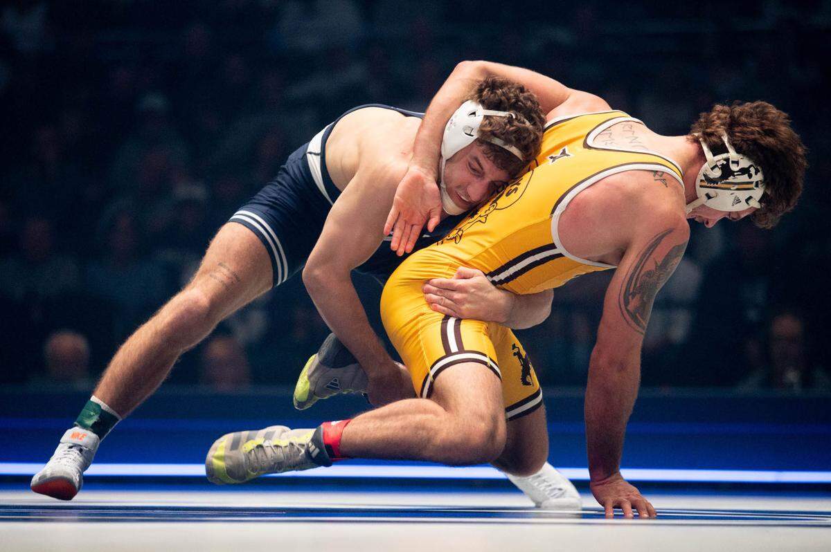 At 165, Mitchell Mesenbrink, left, wrestles Cooper Voorhees, right, during the dual meet between Penn State and Wyoming on Sunday, Dec. 15, 2024.