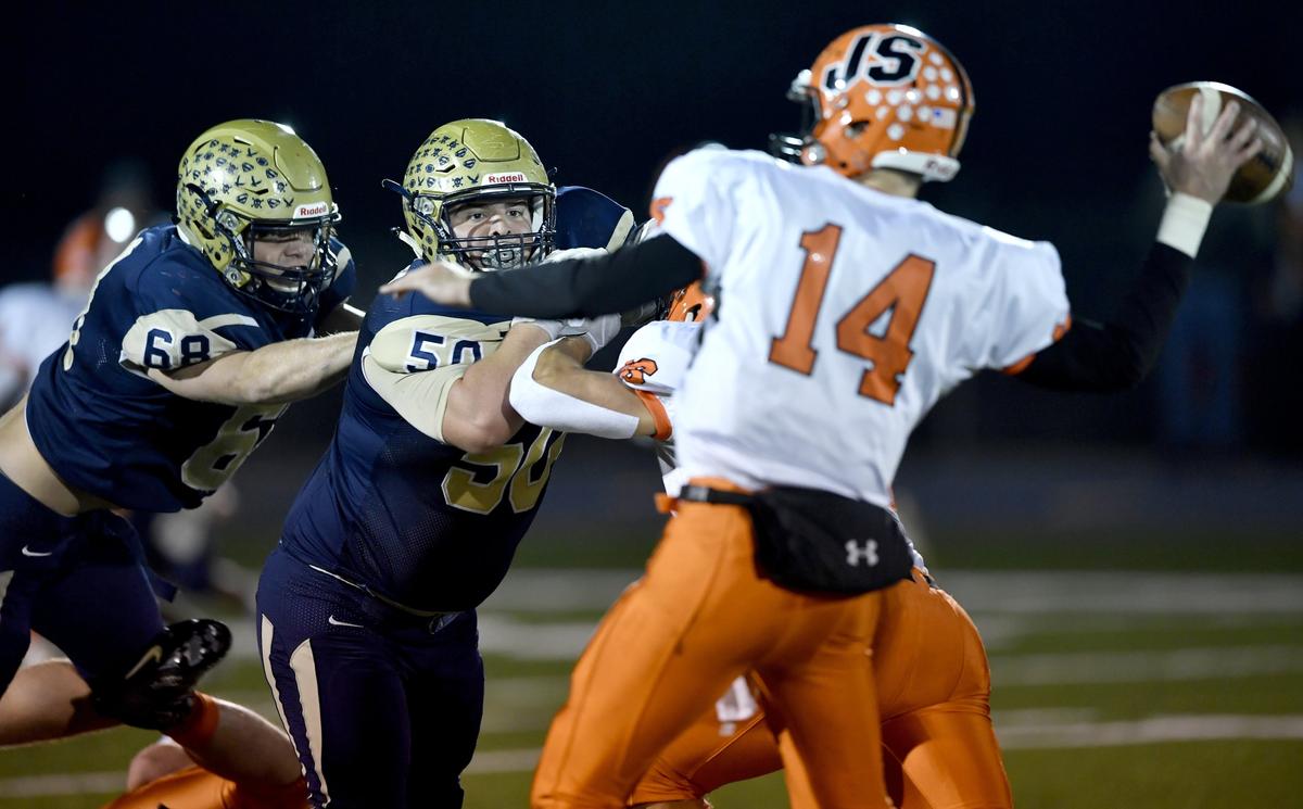 Bald Eagle Area’s David Close tries to push around a Jersey Shore lineman to pressure the quarterback during the game on Friday, Oct. 18, 2019.