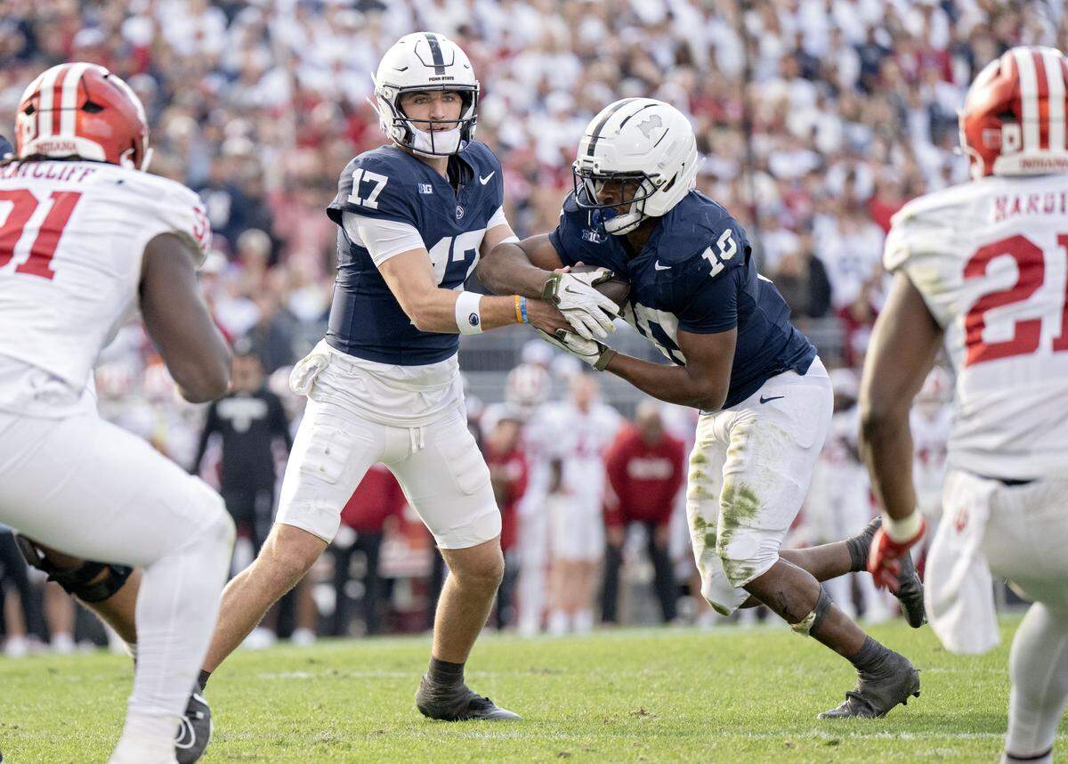 Penn State quarterback Ethan Grunkemeyer hands off to running back Nick Singleton during the game on Saturday, Nov. 8, 2025.