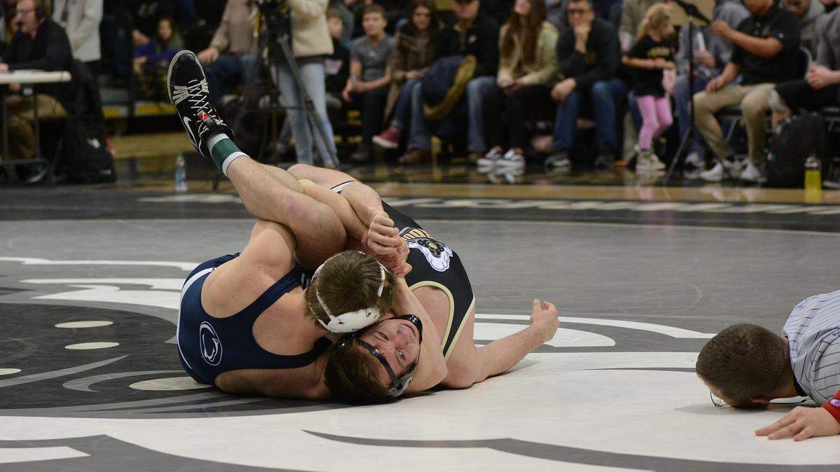 Penn State’s Jason Nolf looks for a pin of Purdue’s Elijah Davis in their 157-pound match of the Nittany Lions’ 30-10 win on Friday, January 25, 2019. Nolf did pin Davis in 42 seconds for his 55th career fall.