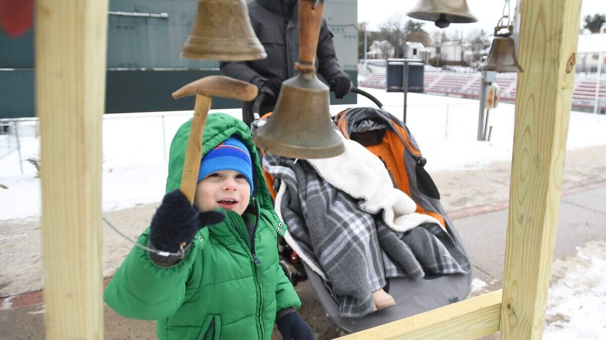 Rocco DeDonato rings the first bells during First Night State College Sunday, Dec. 31, 2017 in downtown State College.