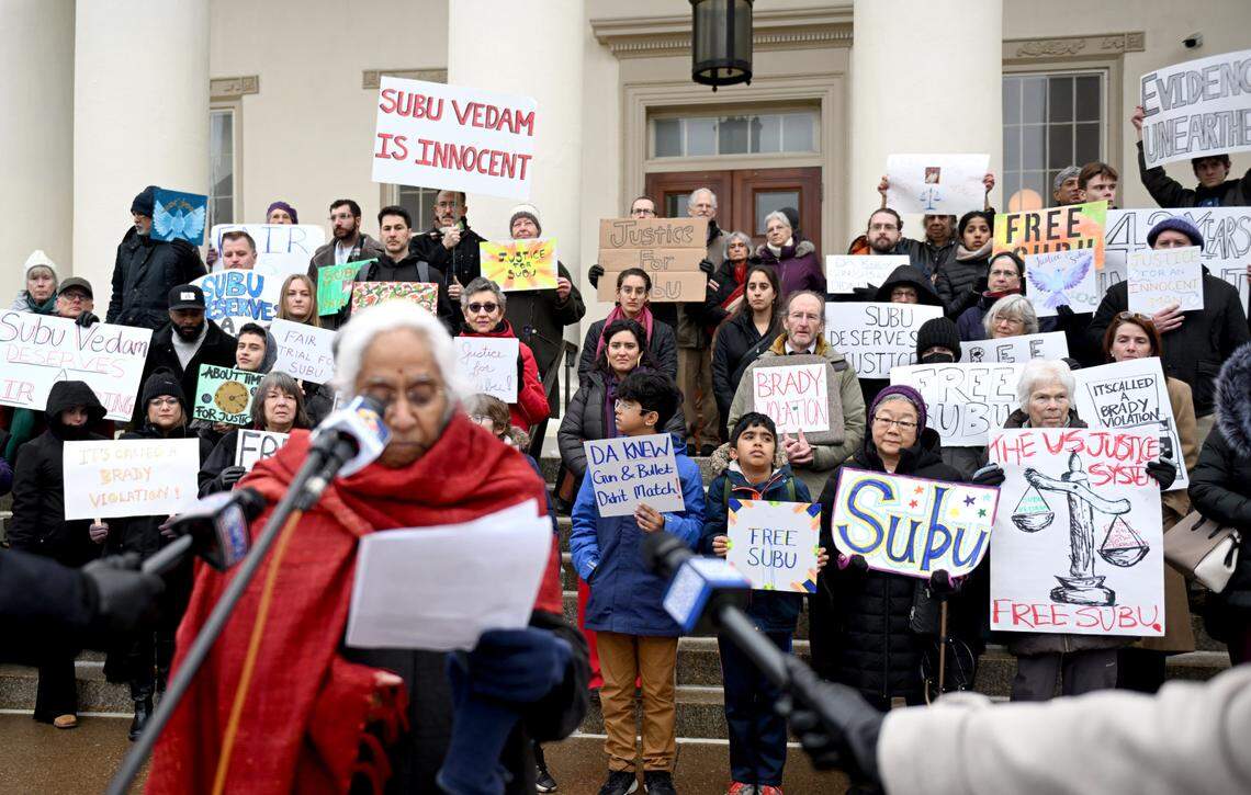 Supporters for Subramanyam “Subu” Vedam hold posters as Saraswathi Vedam talks about seeking justice for her brother before his Post-Conviction Relief Act hearing on Thursday, Feb. 6, 2025 at the Centre County Courthouse.