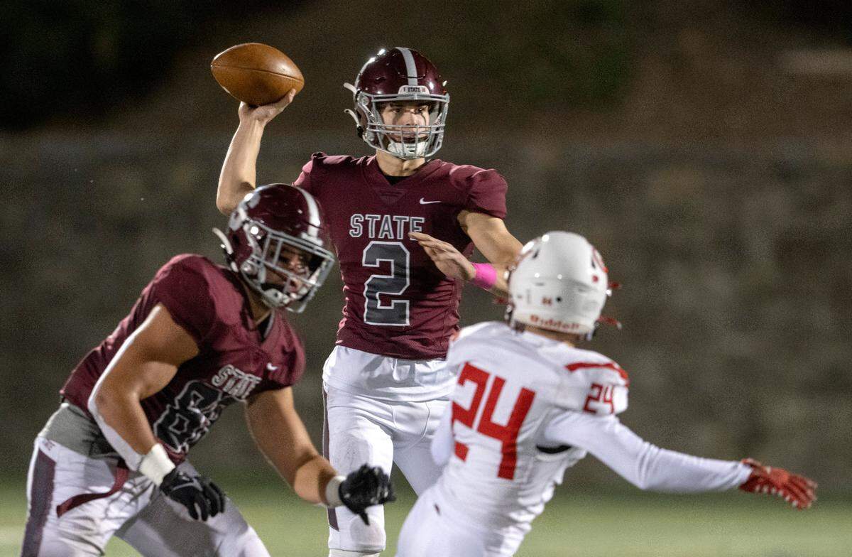 State College’s Finn Furmanek makes a pass during the game against Cumberland Valley on Friday, Oct. 21, 2022 at Memorial Field.