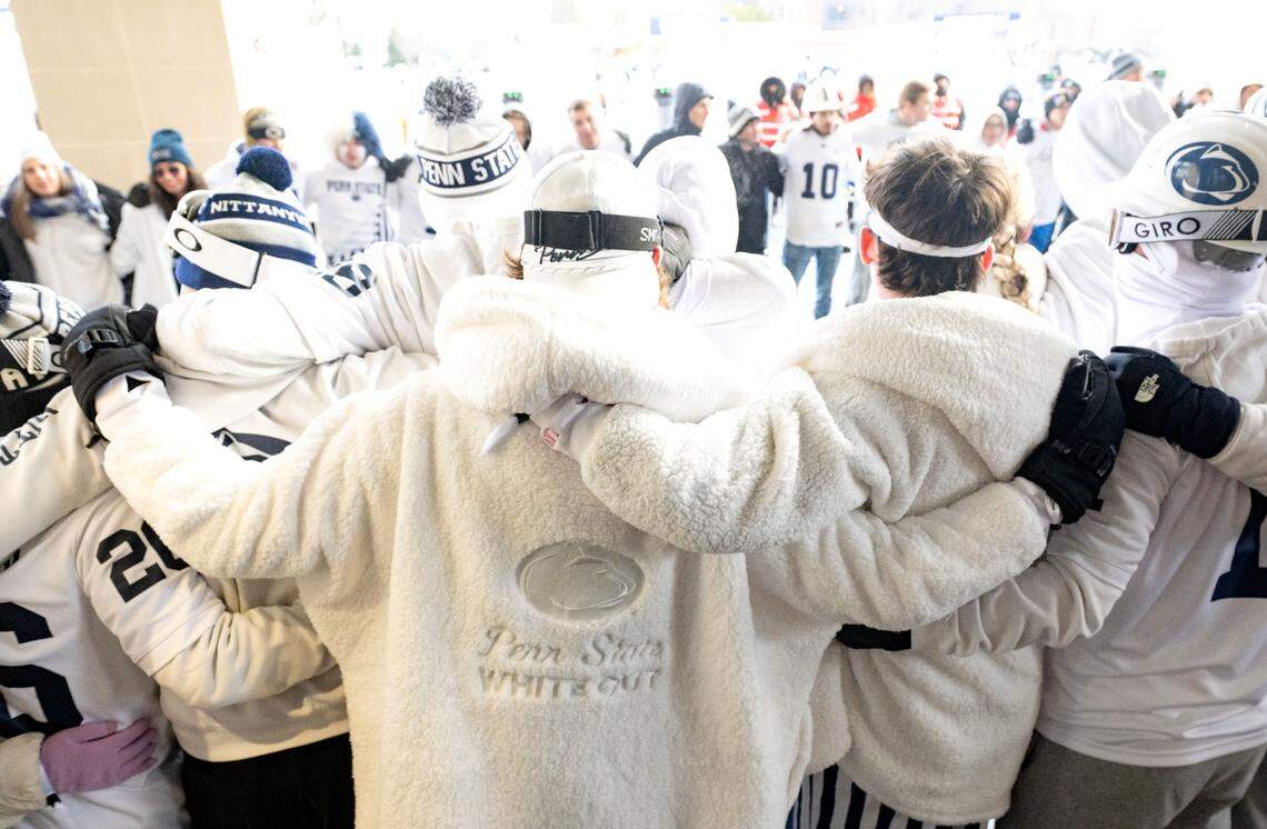 Penn State students sing the alma mater together as they wait to be let into Beaver Stadium for the CFP first round game between Penn State and SMU on Saturday, Dec. 21, 2024.