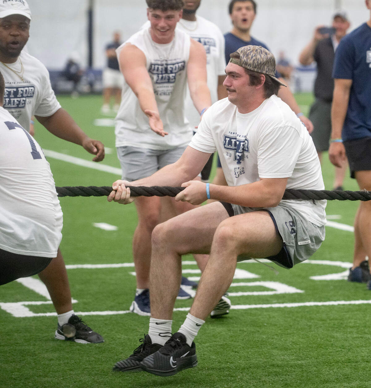 Penn State offensive lineman Eagan Boyer and the offense compete against the defense in tug-of-war during the 21st Annual Lift for Life to benefit Uplifting Athletes on Thursday, June 13, 2024 in Holuba Hall.