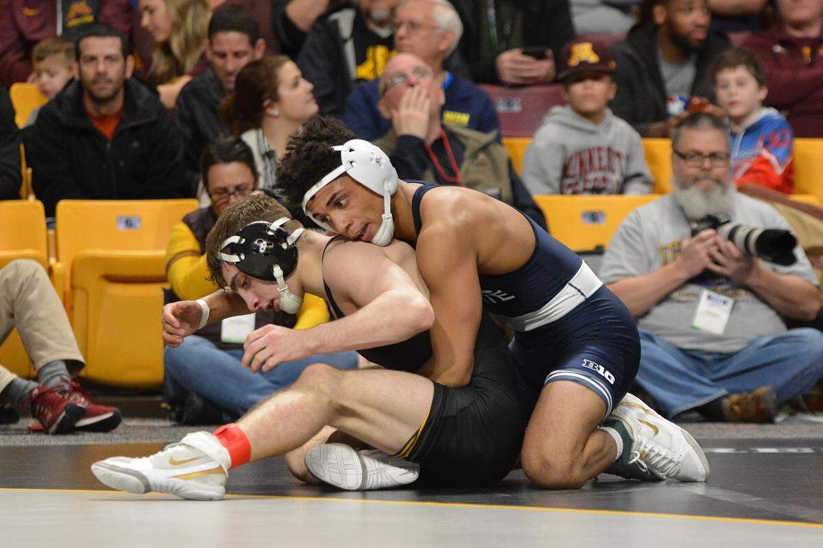 Penn State’s Roman Bravo-Young controls Iowa’s Austin Desanto in their 133-pound consolation semifinals bout of the Big Ten wrestling championships on Sunday in Minneapolis, Minn. DeSanto beat Bravo-Young 13-8 to send the Nittany Lions wrestler to the fifth-place match.