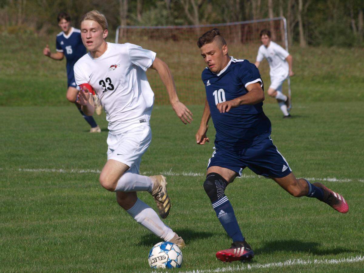 Penns Valley senior midfielder Nate Long (10) mounts the attack from the left side of the pitch as Clearfield defender Cole Miller (33) attempts to win the ball in Penns Valley’s contest vs Clearfield on Monday, Sept. 27, 2021, in Spring Mills.&nbsp;