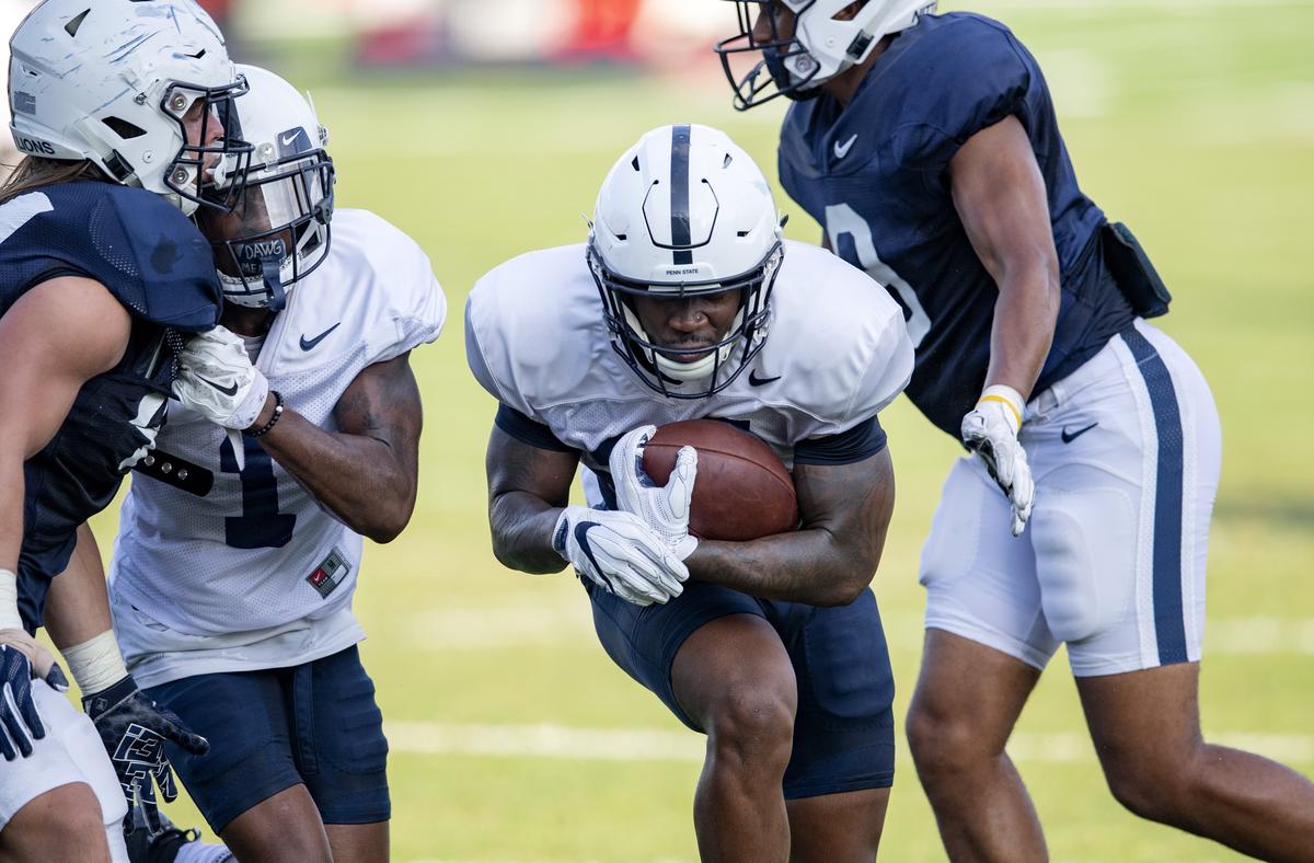 Penn State running back Miles Sanders tries to dodge through defenders during practice on Wednesday, Aug. 29, 2018.
