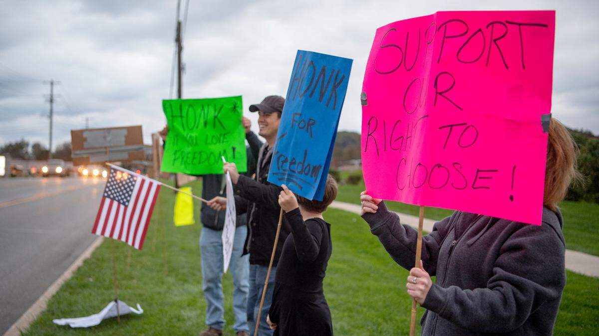 Community members protest the school mask mandate on Oct. 22 outside of Bald Eagle Area high school.