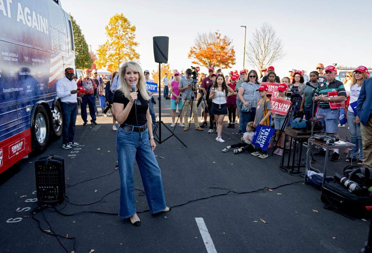 Monica Crowley, former assistant secretary of the Treasury for public affairs, speaks to the crowd during a stop of the “Team Trump” bus tour in a parking lot near Beaver Stadium on Tuesday, Oct. 22, 2024.