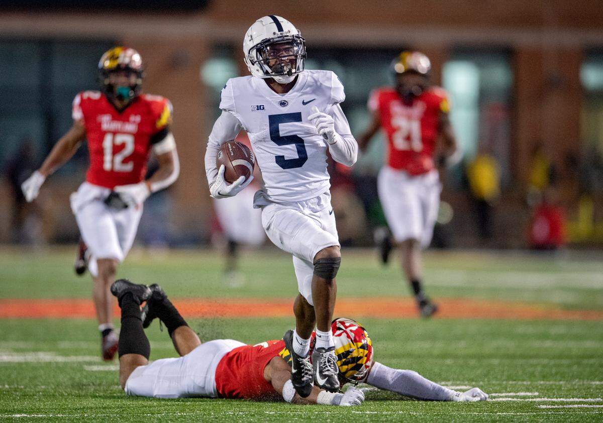 Maryland defenders can’t stop Penn State wide receiver Jahan Dotson as he runs for a touchdown during the fourth quarter of the game on Saturday, Nov. 6, 2021.