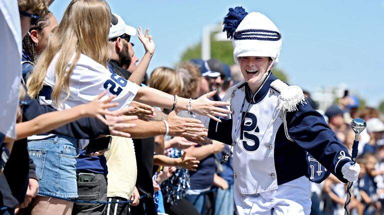 Penn State Blue Band’s first-ever female drum major nails flip in opener. Check it out
