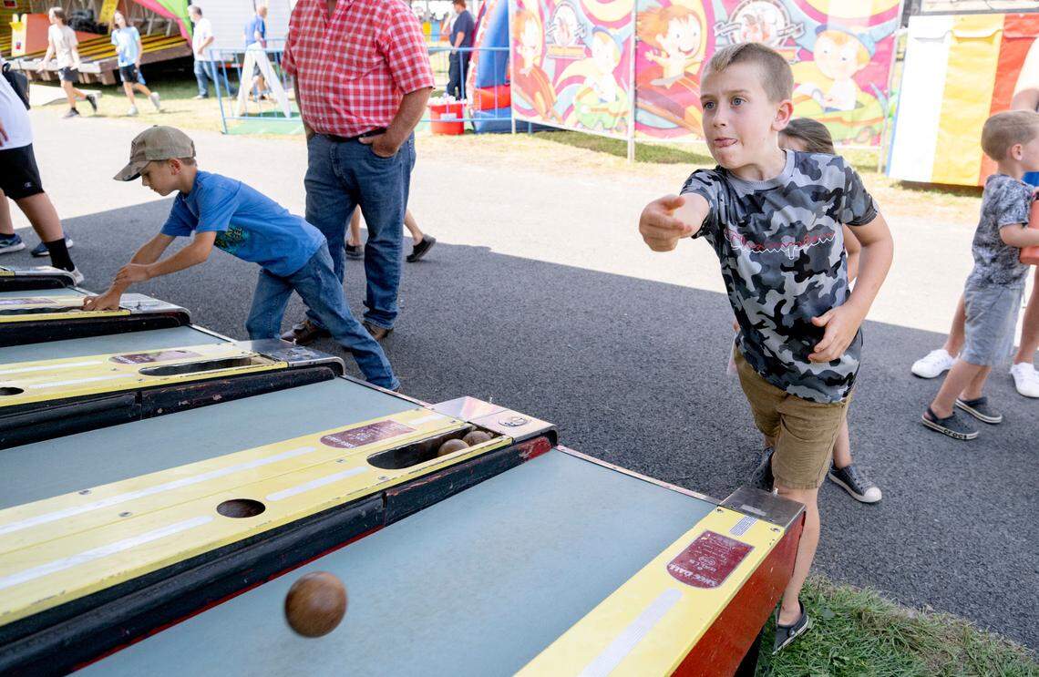 Taycen Mclaughlin, 8, plays skeeball at the Centre County Grange Fair on Friday, Aug. 19, 2022.