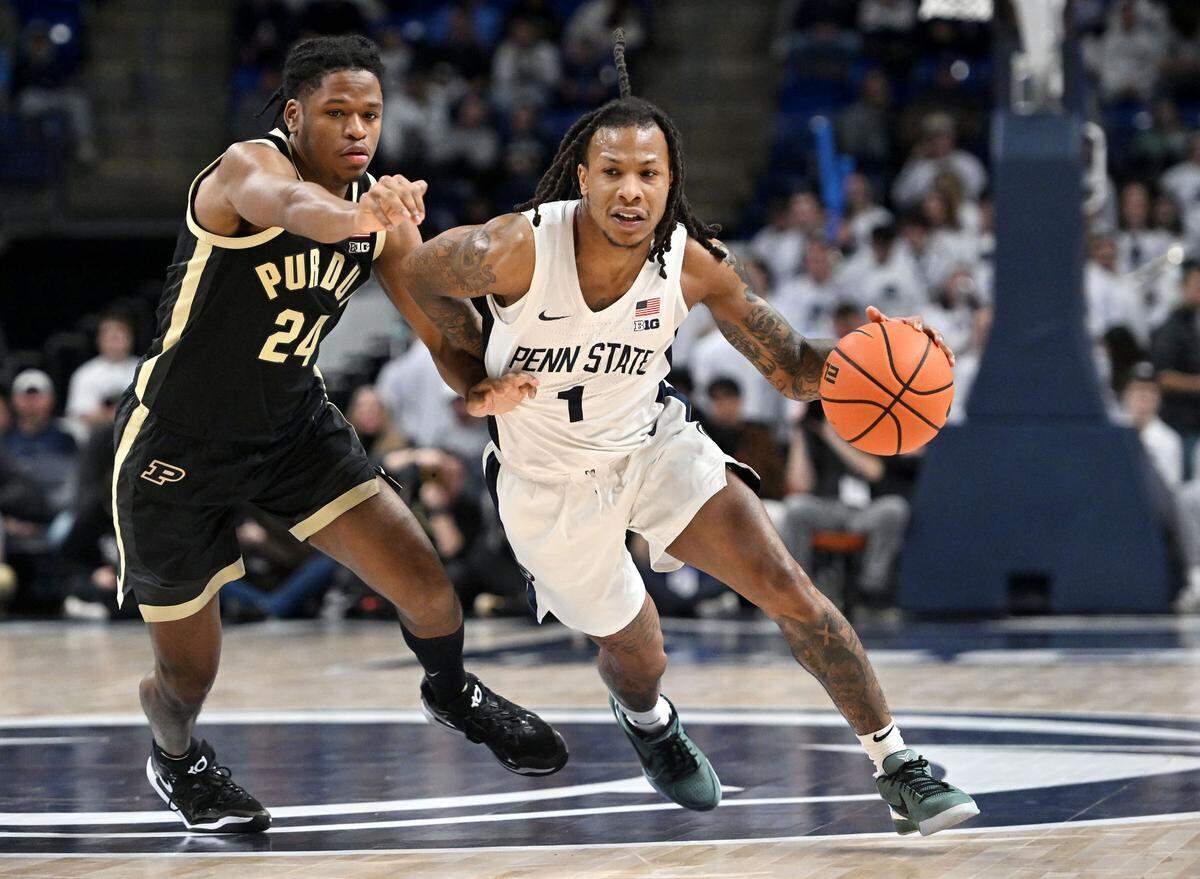 Purdue’s Gicarri Harris can’t stop Penn State’s Ace Baldwin Jr. as he dribbles down the court with the ball during the game on Thursday, Dec. 5, 2024.