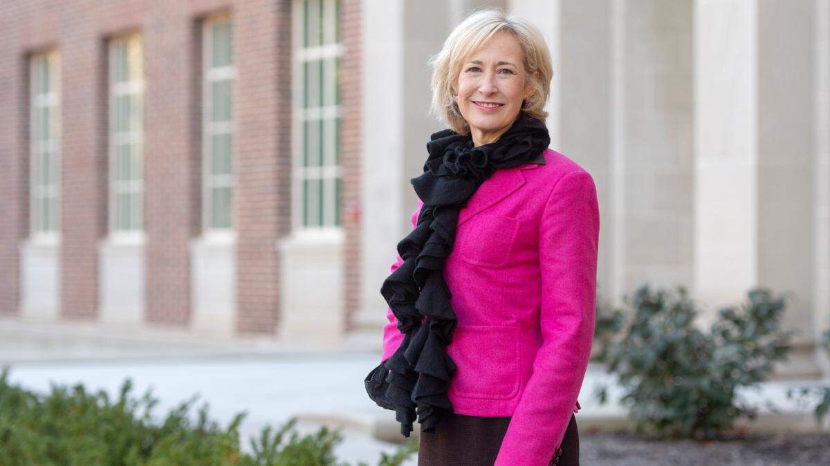 Dean of Penn State College of Communications Marie Hardin poses in 2021 outside the section of the Willard Building that was renovated to become the new media center.