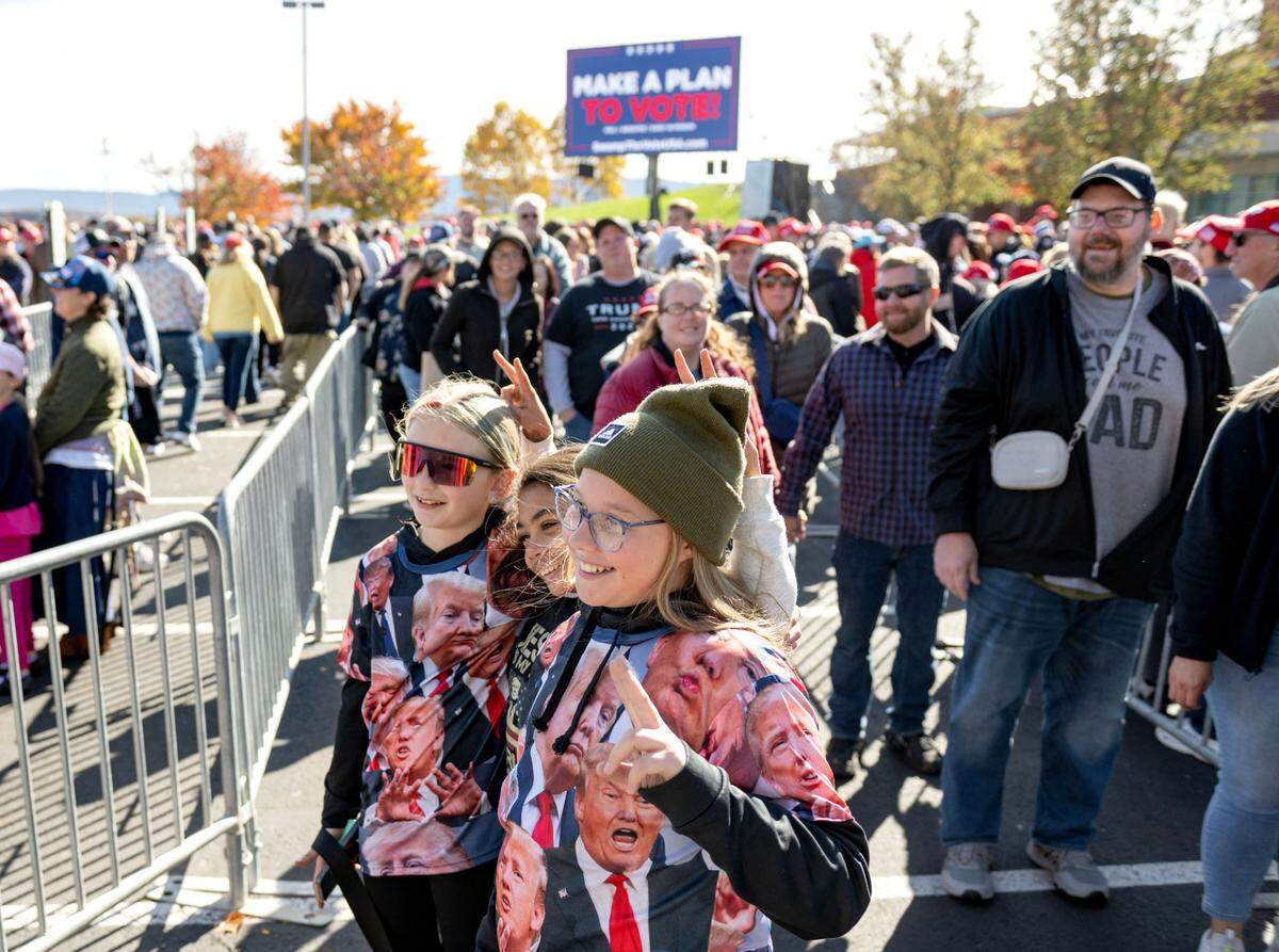 Trump supporters line up to enter the Bryce Jordan Center for a rally on Saturday, Oct. 26, 2024.