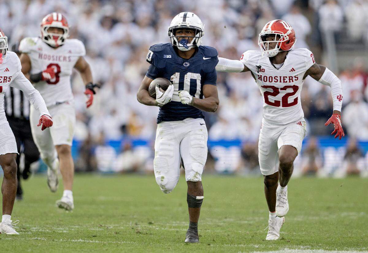 Penn State running back Nick Singleton cuts down the field with the ball from Indiana defenders during the game on Saturday, Nov. 8, 2025.