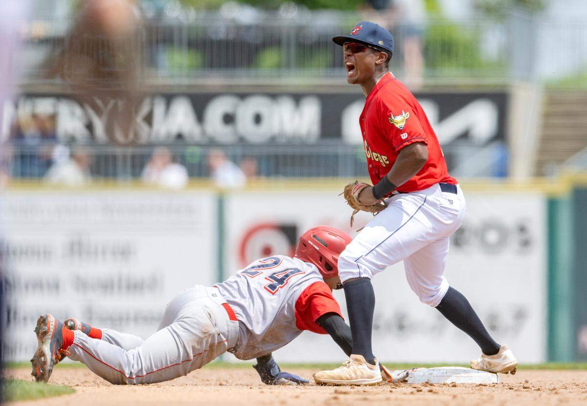 State College Spikes’s DeAndre Shelton celebrates tagging out Williamsport Crosscutters’ Taylor Jackson during the Thursday, Aug. 4, 2022 game.  