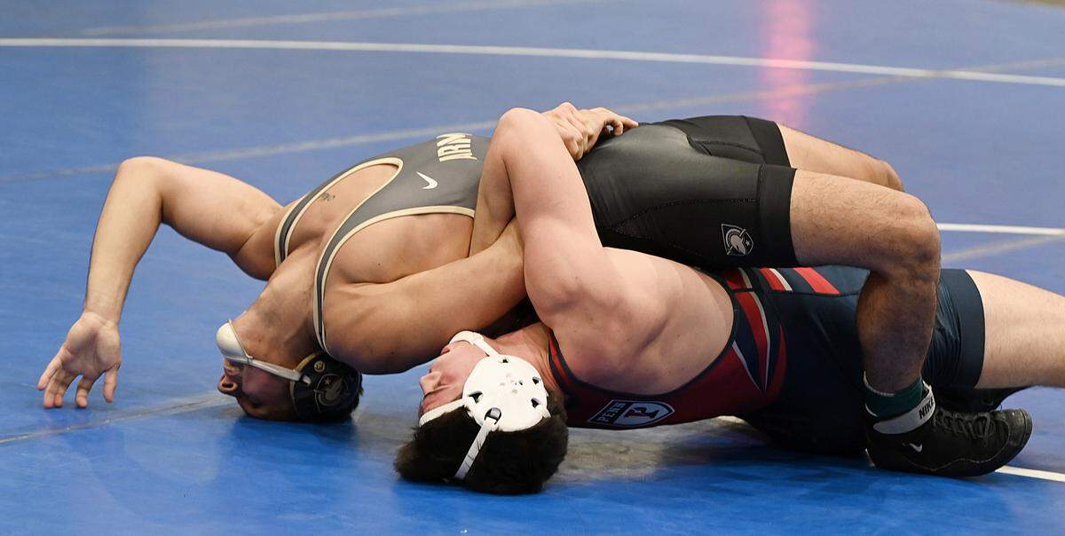 Penn’s Jude Swisher, who is a Bellefonte graduate, looks for back points on Army’s Oscar Aranda in their 157-pound bout of the 2023 Journeymen Collegiate Classic at Freedom High School in Bethlehem.