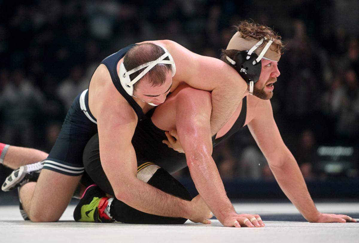 Penn State’s Max Dean controls Iowa’s Jacob Warner in the 197 lb bout of the match on Friday, Jan. 27, 2023 at the Bryce Jordan Center. Dean won by decision, 2-0.