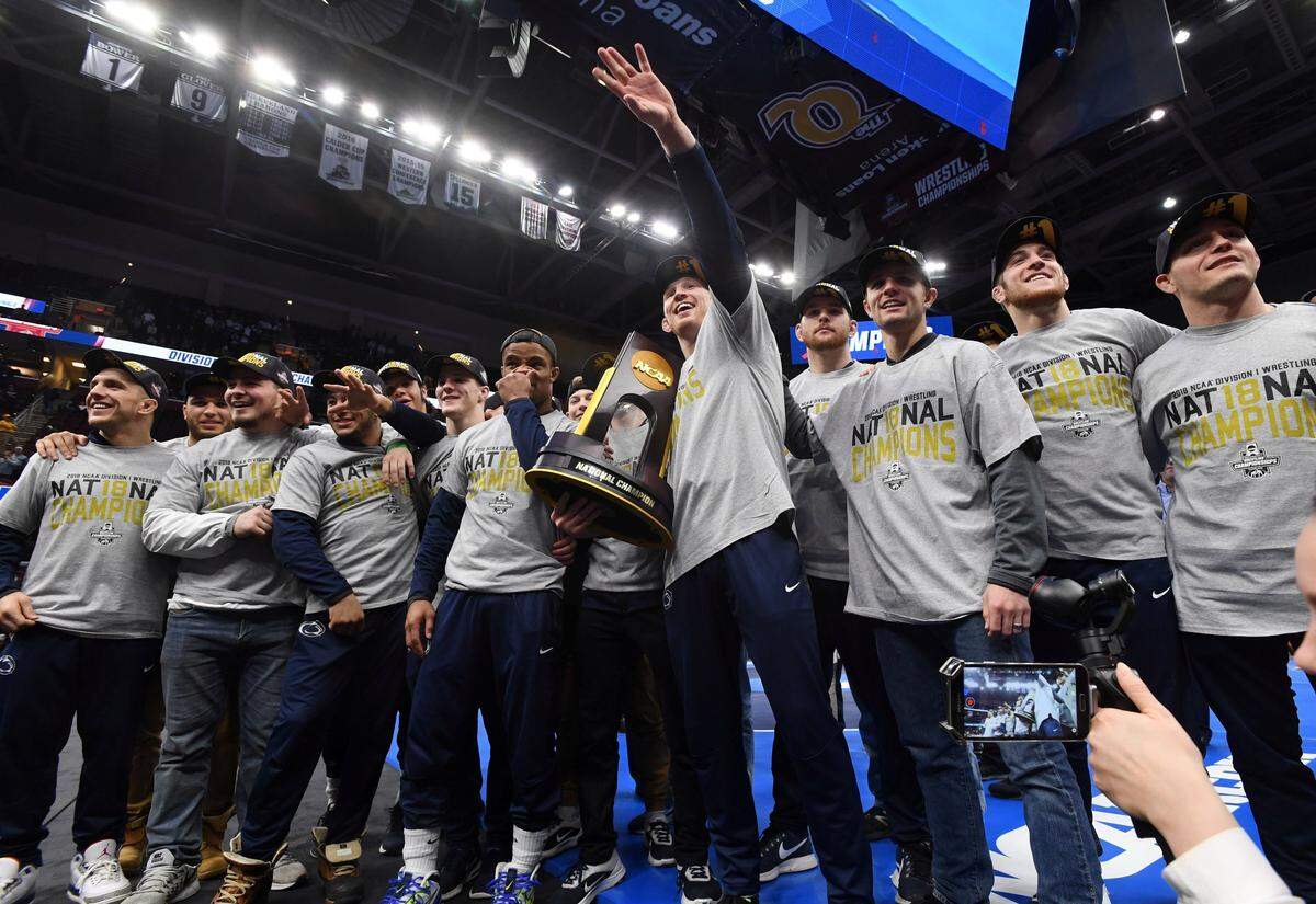 The Penn State wrestling team celebrates placing first in the NCAA Division I Wrestling Championships Saturday, March, 17, 2018 at the Quicken Loans Arena in Cleveland, Ohio.
