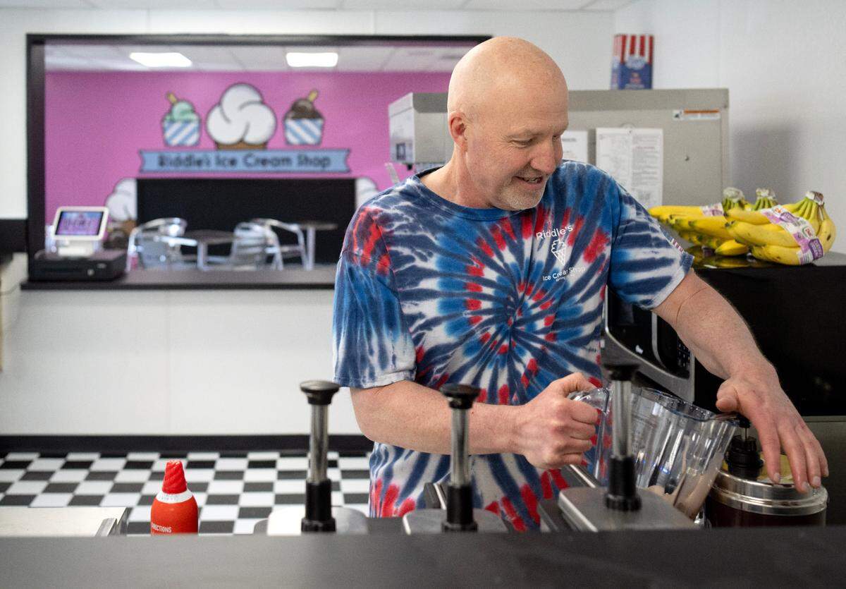 Andy Riddle helps to make a Boston Shake at Riddle’s Ice Cream Shop on Thursday, March 7, 2024.