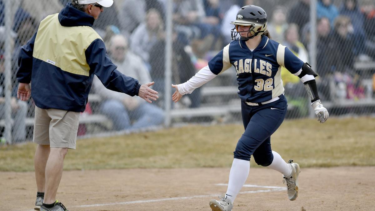 Bald Eagle Area softball coach Don Lucas high fives Maddie Peters as she rounds third from her homer during the game against Philipsburg-Osceola on Thursday, April, 4, 2019.