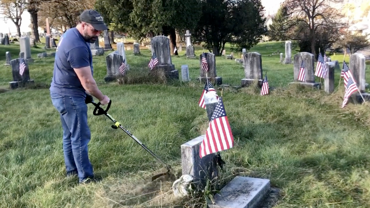 Bellefonte resident Dave Sexton removes weeds around grave stones in the Soldier’s Circle in the Union Cemetery, Bellefonte.