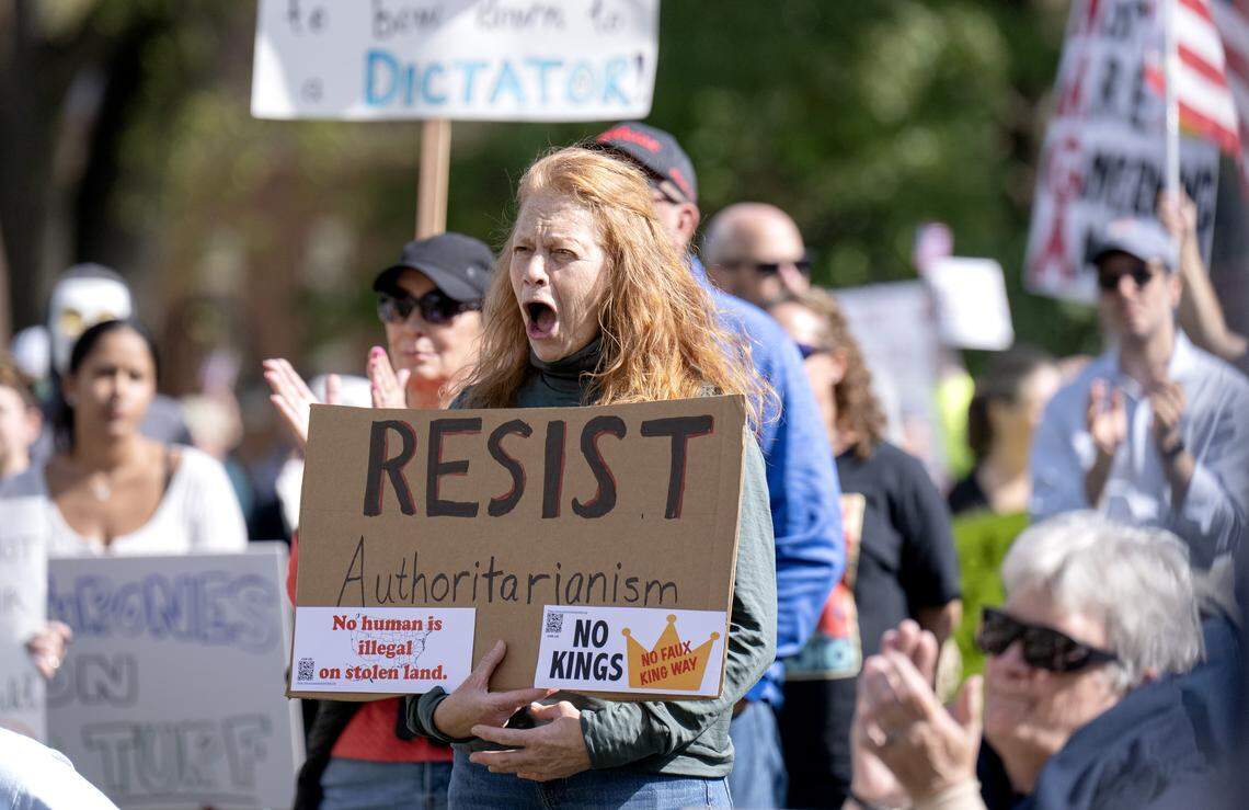 Protesters yell and applaud during the No Kings anti-Trump rally on Saturday, Oct. 18, 2025. 