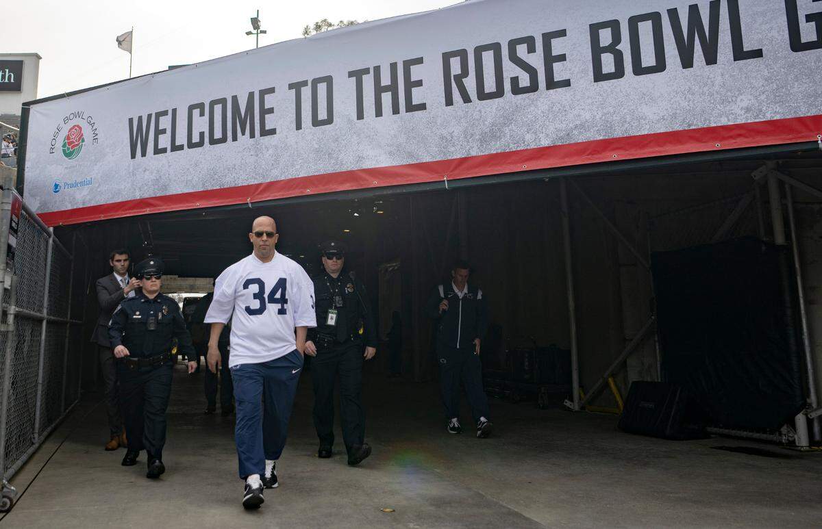 Penn State football coach James Franklin walks into the Rose Bowl stadium in a Franco Harris jersey for the game against Utah on Monday, Jan. 2, 2023. The entire Penn State football team wore Harris jerseys for their arrival.