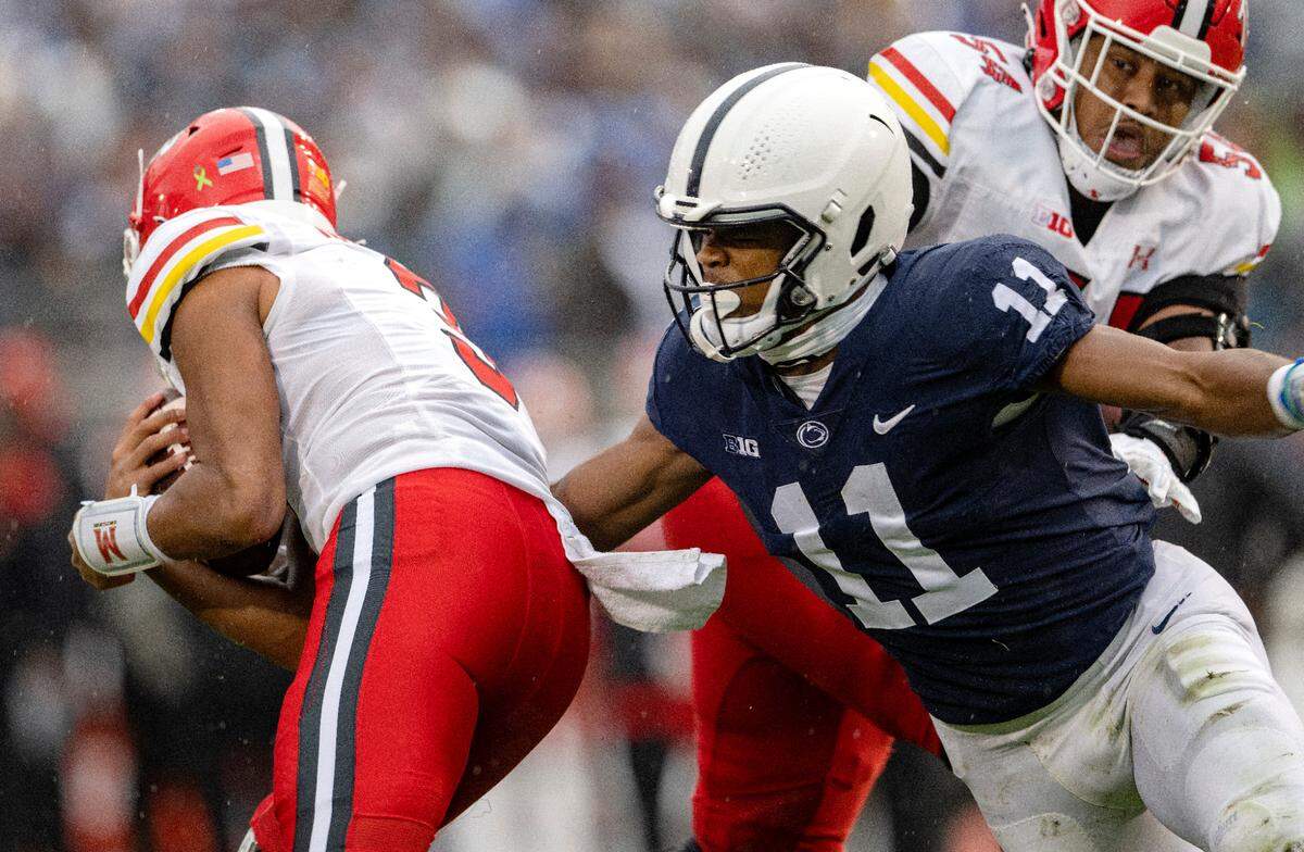 Penn State linebacker Abdul Carter reaches for Maryland quarterback Taulia Tagovailoa during the game Saturday.