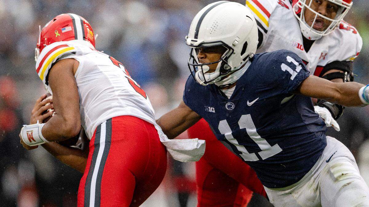 Penn State linebacker Abdul Carter reaches for Maryland quarterback Taulia Tagovailoa during the game on Saturday, Nov. 12, 2022.