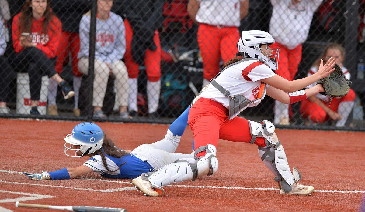 Bellefonte catcher Grace Novitsky cant pull in the throw in time to make the tag at home on Central Mountain’s Allison Lininger in the District 6 5A title championship game with Central Mountain Wednesday, May 25, at St. Francis University.