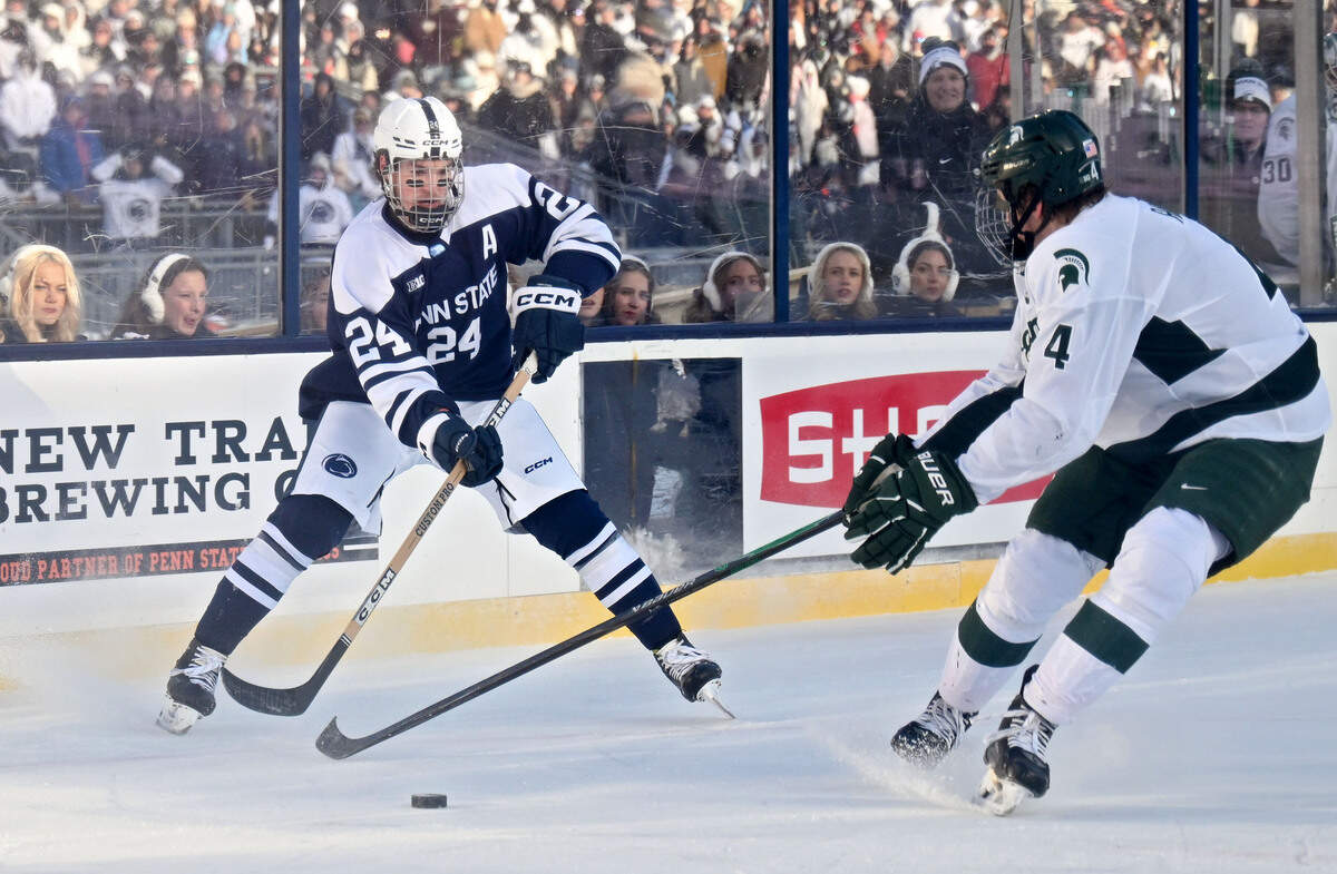 Penn State's Jarod Crespo makes a pass around a Michigan State defender during the game on Saturday, Jan. 31, 2026 at Beaver Stadium.
