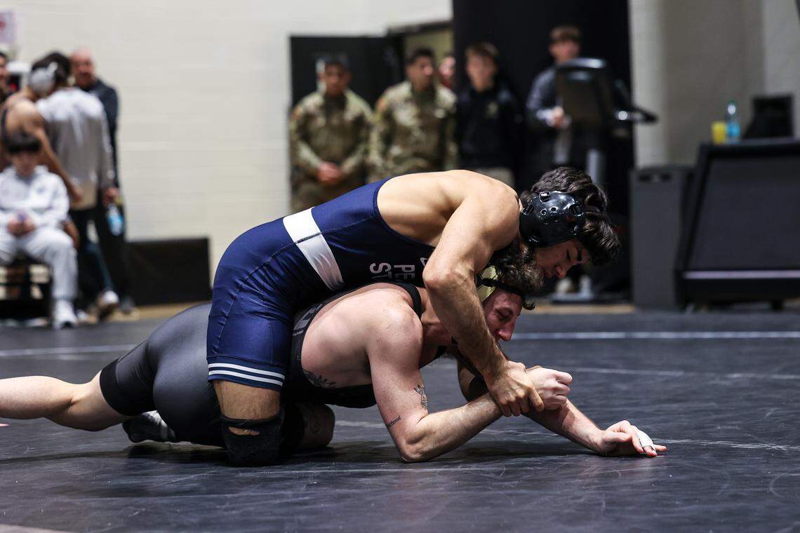 Penn State’s Aaron Nagao controls Army West Point’s Braden Basile in their 141-pound finals match of the Black Knight Invitational on Sunday, Nov. 23, 2025 in West Point, NY. Nagao got hurt in the match, and had to default out.
