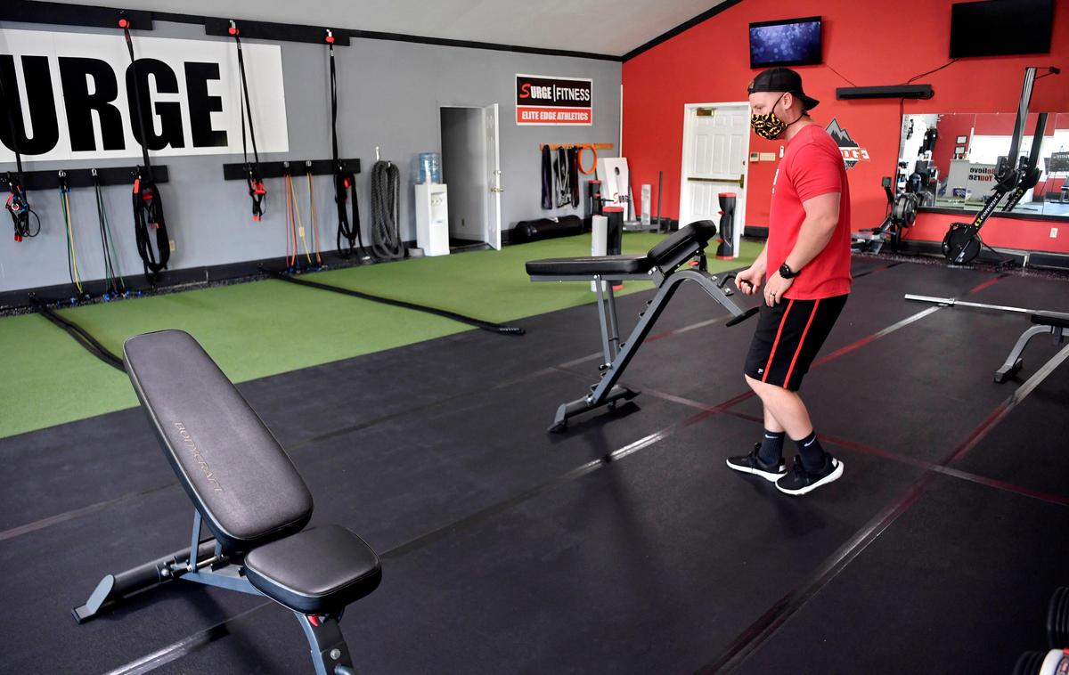 John Kmiecinski of Elite Edge Athletics sets up a work out circuit making sure everyone will be able to maintain social distancing on Friday, May 29, 2020. The gym will reopen on Monday after being closed since March due to the coronavirus pandemic.