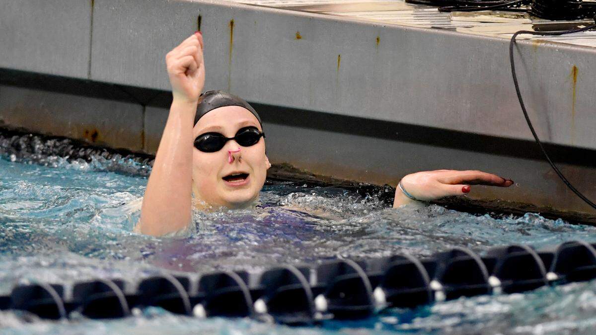 State College’s Jade Castro celebrates her second place finish in the 100-yard backstroke at the PIAA swimming championships at Bucknell on Thursday.