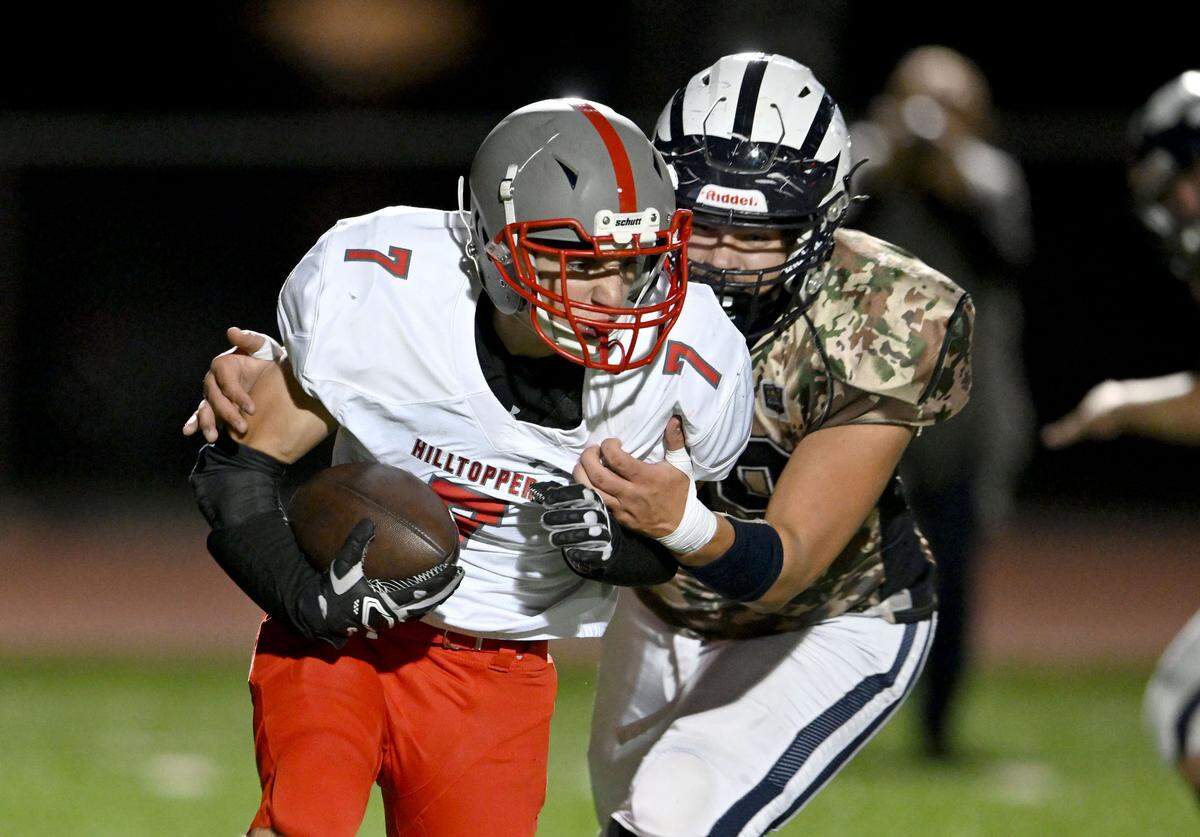 Philipsburg-Osceola’s Ryan McClure stops Westmont Hilltop’s Tyler Galiote during the game on Friday, Oct. 11, 2024.