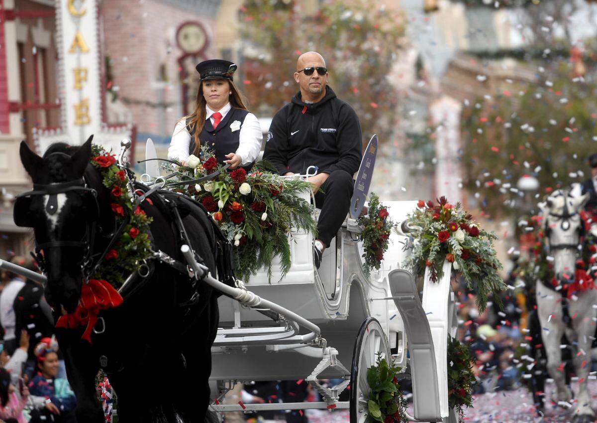 Penn State football coach James Franklin rides in a carriage along Main Street USA in Disneyland as part of the Rose Bowl kick off event on Wednesday, Dec. 28, 2022