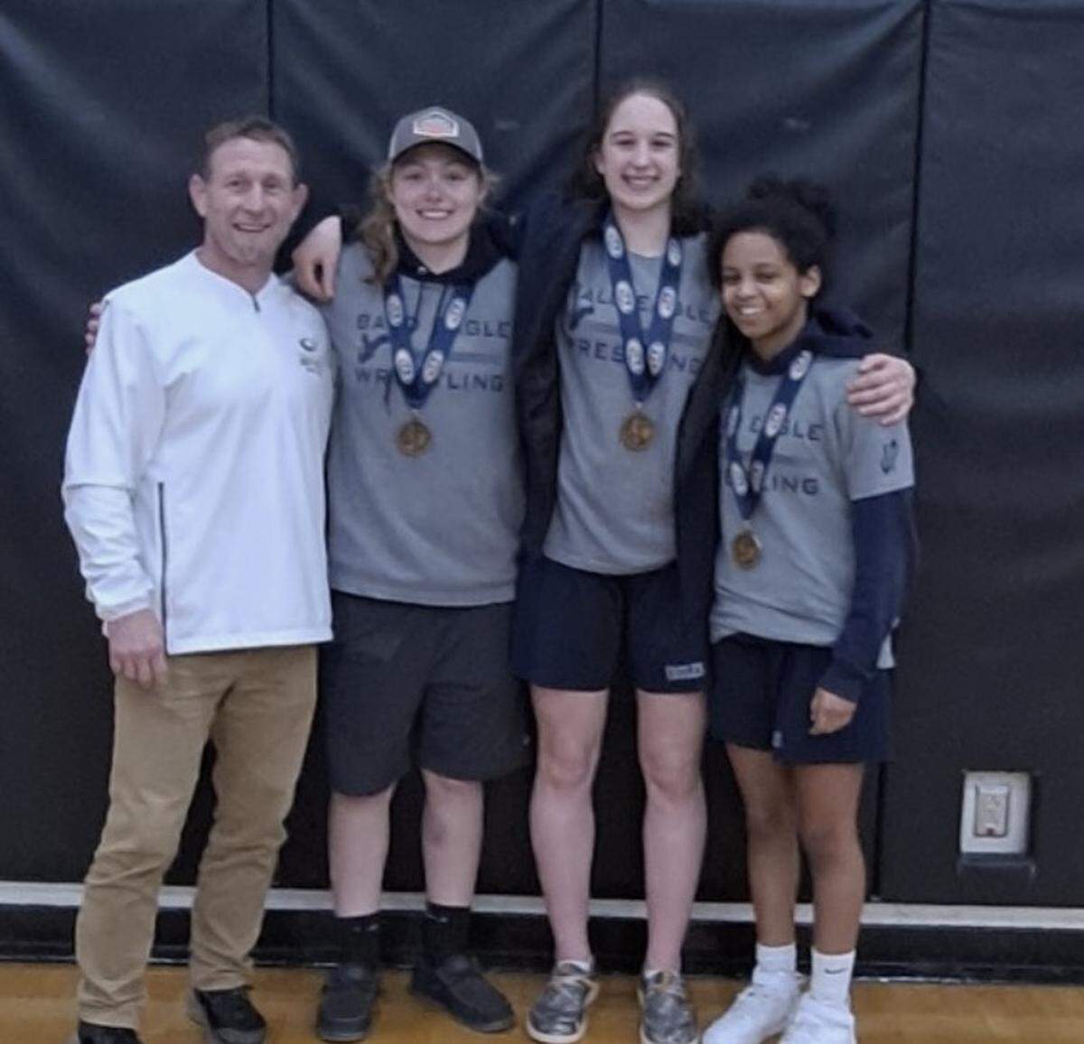 Bald Eagle Area had three girls make the PIAA Championships after placing in the top 4 of their weight at the PIAA Central Regional on Saturday, March 4, 2024 at Milton High School. From left, head coach Eddie Hockenberry, Grace Crestani, Angie Grieb and Eden Eveleth.