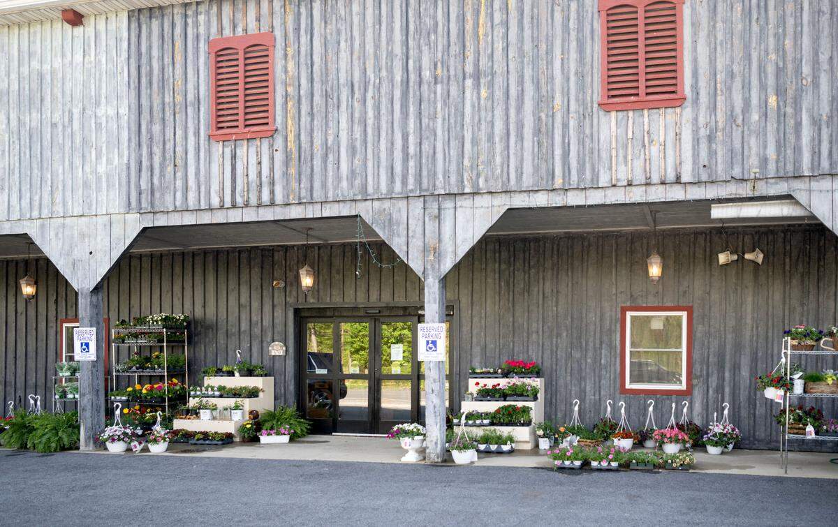Flowers for sale are displayed outside of the newly opened Sowers Market at 670 Tyrone Pike in Philipsburg.