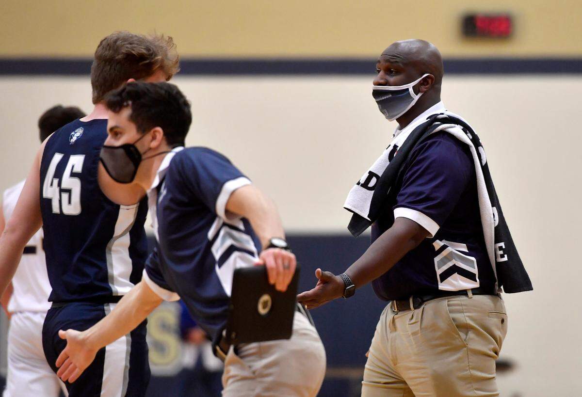 Philipsburg-Osceola boys basketball coach TJ Anderson high fives players as they come for a time out during the game against Bald Eagle Area on Friday, Jan. 22, 2021.