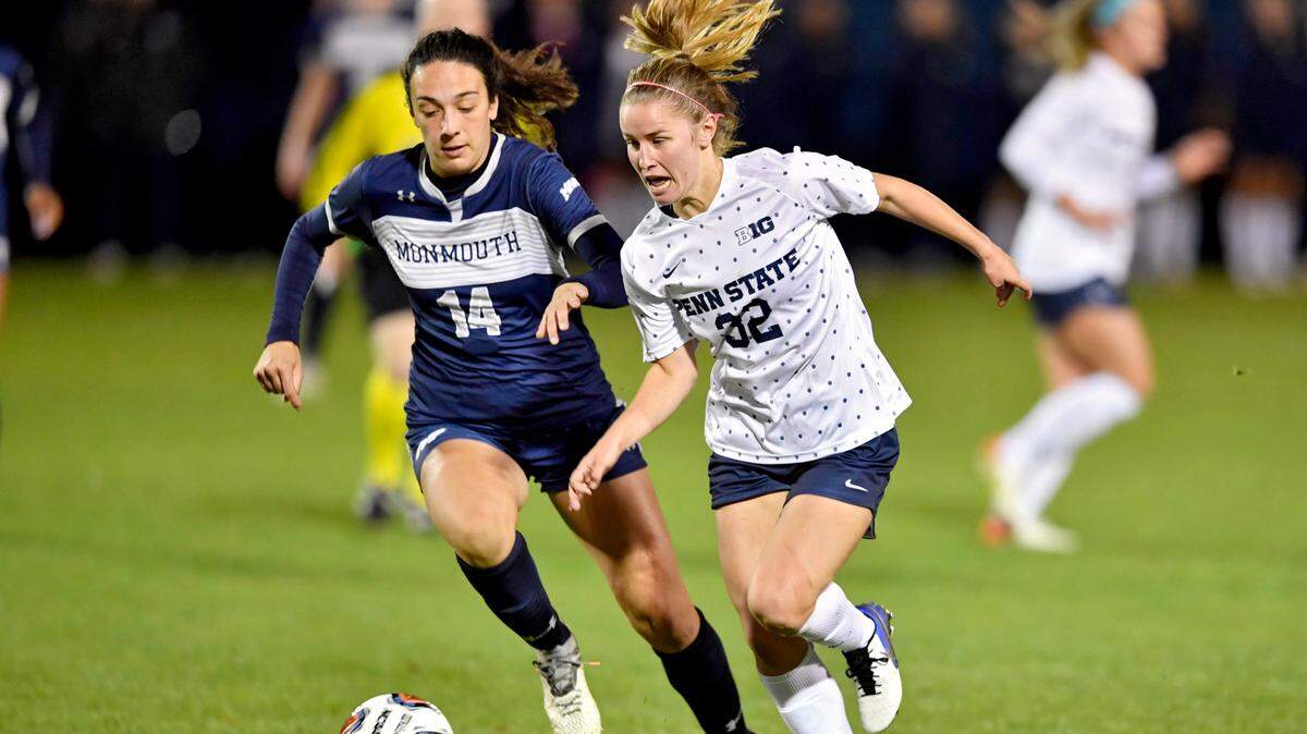 Penn State women’s soccer’s Natalie Wilson runs down the field with the ball ahead of a Monmouth defender during the game on Friday, Nov. 12, 2021. Penn State won, 3-1.